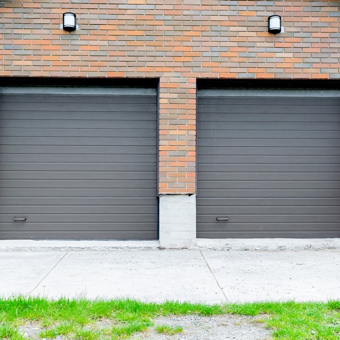 Customer reviewing the installation of a new garage door opener